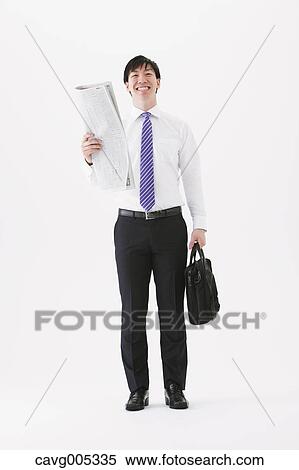 Businessman with newspaper View Large Photo Image Stock Photography - Businessman with newspaper. Fotosearch