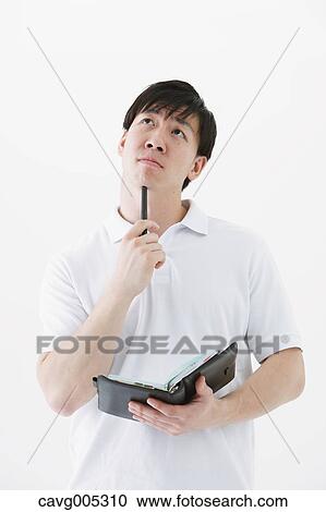 Businessman with notebook View Large Photo Image Stock Image - Businessman with notebook. Fotosearch