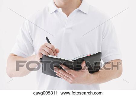 Businessman with notebook View Large Photo Image Stock Image - Businessman with notebook. Fotosearch