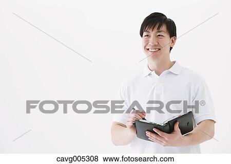 Businessman with notebook View Large Photo Image Stock Photo - Businessman with notebook. Fotosearch