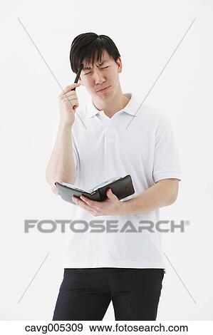 Businessman with notebook View Large Photo Image Stock Photo - Businessman with notebook. Fotosearch