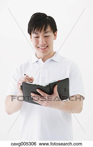 Businessman with notebook View Large Photo Image Stock Photograph - Businessman with notebook. Fotosearch