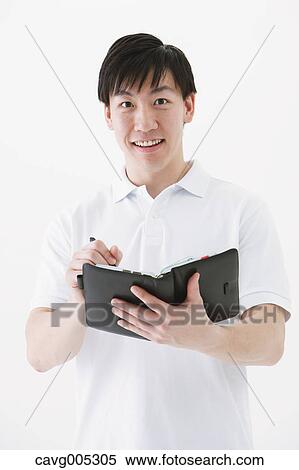 Businessman with notebook View Large Photo Image Stock Photography - Businessman with notebook. Fotosearch