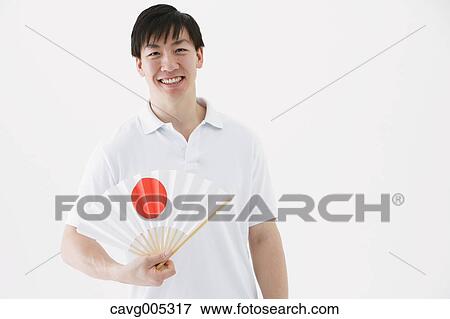 Businessman with paper fan View Large Photo Image Stock Photo - Businessman with paper fan. Fotosearch