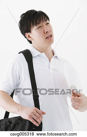 Businessman with paper fan View Large Photo Image Stock Photo - Businessman with paper fan. Fotosearch
