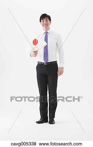 Businessman with paper fan View Large Photo Image Stock Photo - Businessman with paper fan. Fotosearch