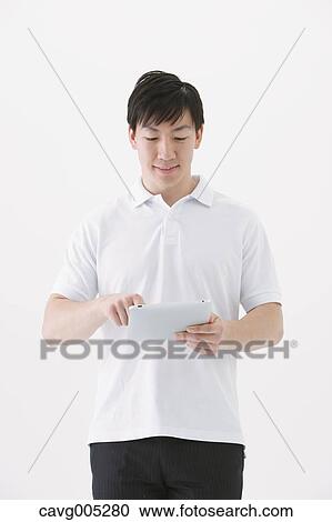 Businessman with tablet View Large Photo Image Stock Image - Businessman with tablet. Fotosearch