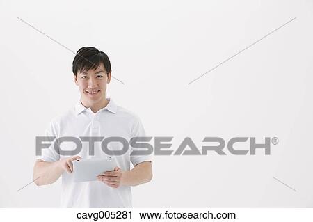 Businessman with tablet View Large Photo Image Stock Image - Businessman with tablet. Fotosearch