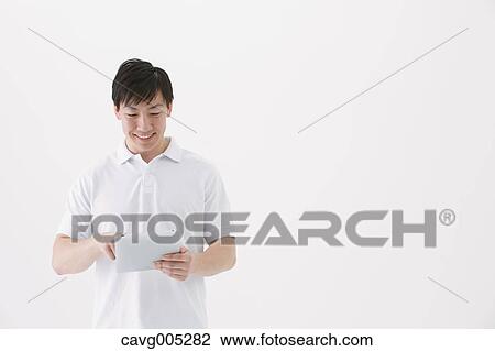 Businessman with tablet View Large Photo Image Stock Image - Businessman with tablet. Fotosearch