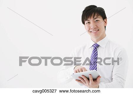 Businessman with tablet View Large Photo Image Stock Photo - Businessman with tablet. Fotosearch