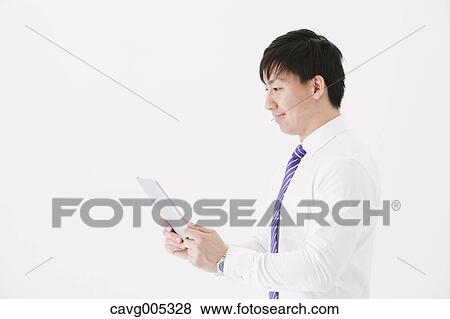 Stock Photo - Businessman with tablet. Fotosearch