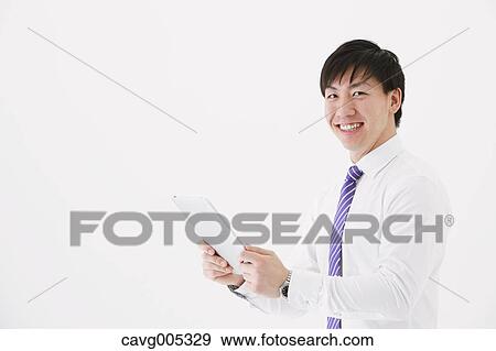 Businessman with tablet View Large Photo Image Stock Photo - Businessman with tablet. Fotosearch