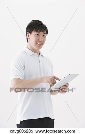 Businessman with tablet View Large Photo Image Stock Photography - Businessman with tablet. Fotosearch