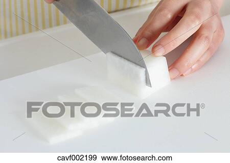 Close up of woman's hands cutting radish with a kitchen knife View Large Photo Image Stock Photo - Close up of woman's hands cutting radish with a kitchen knife. Fotosearch