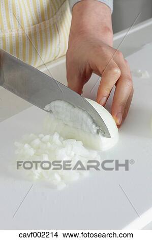 Close up of woman's hands slicing onions with a kitchen knife View Large Photo Image Picture - Close up of woman's hands slicing onions with a kitchen knife. Fotosearch