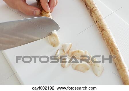 Close up of woman's hands slicing burdocks with a kitchen knife View Large Photo Image Stock Image - Close up of woman's hands slicing burdocks with a kitchen knife. Fotosearch