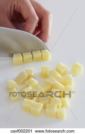 Close up of woman's hands slicing potatoes with a kitchen knife View Large Photo Image Stock Image - Close up of woman's hands slicing potatoes with a kitchen knife. Fotosearch