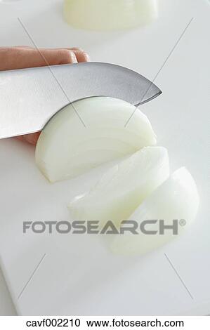 Close up of woman's hands slicing onions with a kitchen knife View Large Photo Image Stock Image - Close up of woman's hands slicing onions with a kitchen knife. Fotosearch