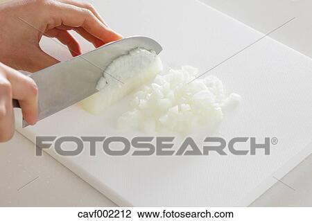Close up of woman's hands slicing onions with a kitchen knife View Large Photo Image Stock Image - Close up of woman's hands slicing onions with a kitchen knife. Fotosearch