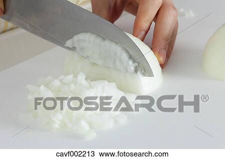 Close up of woman's hands slicing onions with a kitchen knife View Large Photo Image Stock Image - Close up of woman's hands slicing onions with a kitchen knife. Fotosearch