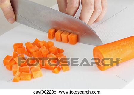 Close up of woman's hands slicing carrots with a kitchen knife View Large Photo Image Stock Photography - Close up of woman's hands slicing carrots with a kitchen knife. Fotosearch