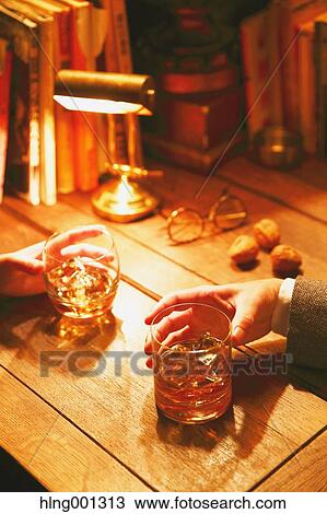 Stock Image - Couple drinking in a fashionable bar. Fotosearch
