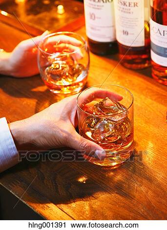 Couple drinking in a fashionable bar View Large Photo Image Stock Image - Couple drinking in a fashionable bar. Fotosearch