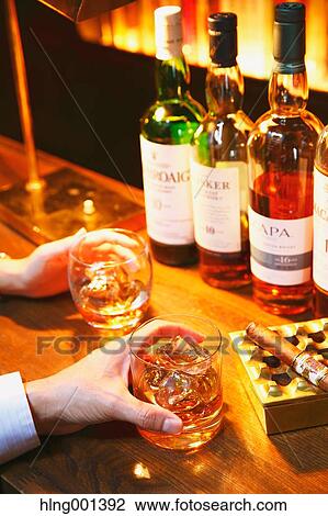 Couple drinking in a fashionable bar View Large Photo Image Stock Image - Couple drinking in a fashionable bar. Fotosearch