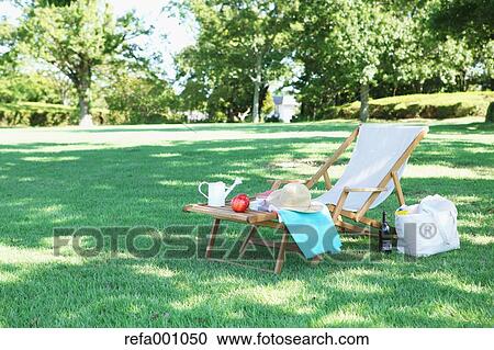 Deck chair in a city park View Large Photo Image Stock Image - Deck chair in a city park. Fotosearch