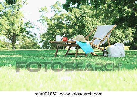Deck chair in a city park View Large Photo Image Stock Image - Deck chair in a city park. Fotosearch
