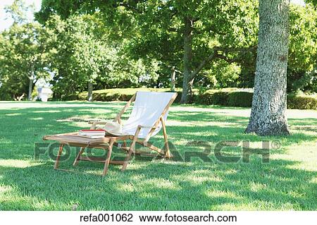 Deck chair in a city park View Large Photo Image Stock Image - Deck chair in a city park. Fotosearch