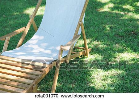 Deck chair in a city park View Large Photo Image Stock Image - Deck chair in a city park. Fotosearch