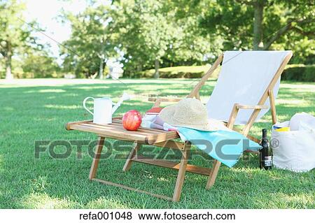 Stock Photo - Deck chair in a city park. Fotosearch
