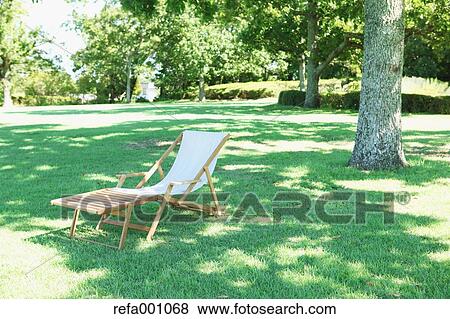 Deck chair in a city park View Large Photo Image Stock Photo - Deck chair in a city park. Fotosearch