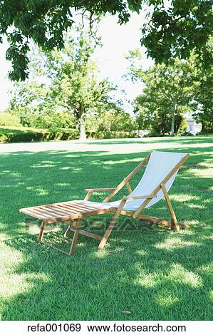Stock Photo - Deck chair in a city park. Fotosearch