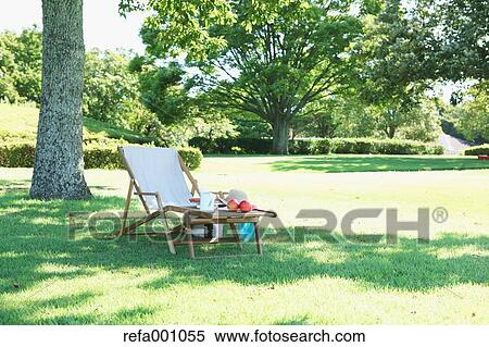 Deck chair in a city park View Large Photo Image Stock Photography - Deck chair in a city park. Fotosearch