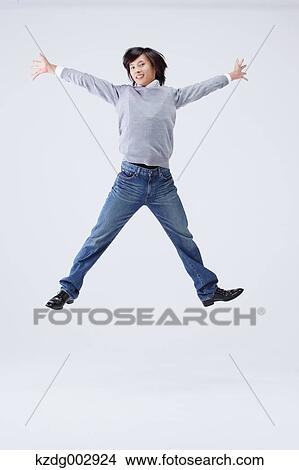 Full body view of young man wearing jeans View Large Photo Image Picture - Full body view of young man wearing jeans. Fotosearch