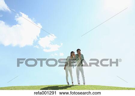Happy Japanese couple in a park View Large Photo Image Stock Image - Happy Japanese couple in a park. Fotosearch