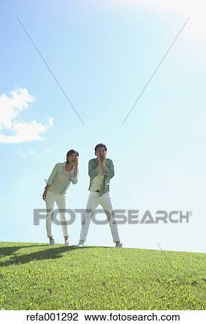 Happy Japanese couple in a park View Large Photo Image Stock Image - Happy Japanese couple in a park. Fotosearch