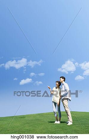 Stock Photo - Happy Japanese couple in a park. Fotosearch
