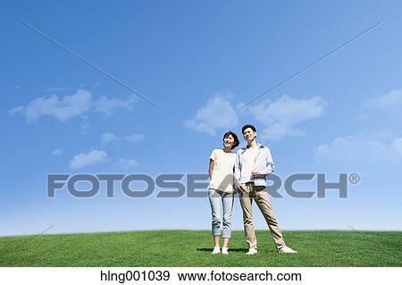 Happy Japanese couple in a park View Large Photo Image Stock Photo - Happy Japanese couple in a park. Fotosearch
