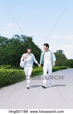 Stock Photo - Happy Japanese couple in a park. Fotosearch