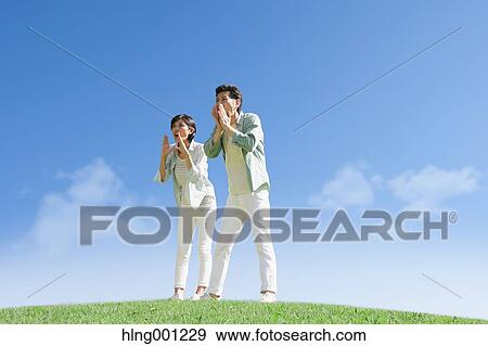 Happy Japanese couple in a park View Large Photo Image Stock Photo - Happy Japanese couple in a park. Fotosearch