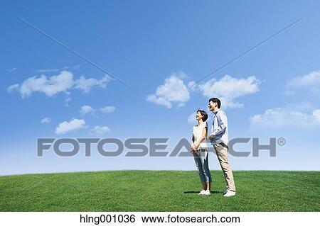 Stock Photograph - Happy Japanese couple in a park. Fotosearch