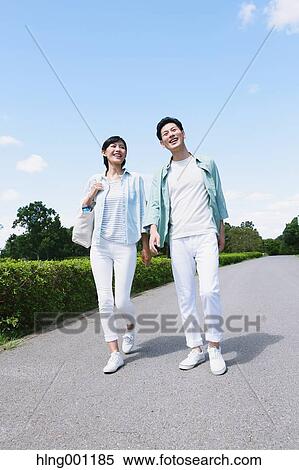 Stock Photography - Happy Japanese couple in a park. Fotosearch