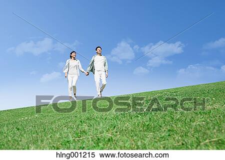 Happy Japanese couple in a park View Large Photo Image Stock Photography - Happy Japanese couple in a park. Fotosearch