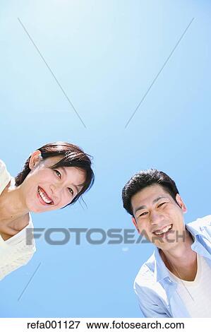 Happy Japanese couple smiling View Large Photo Image Stock Photo - Happy Japanese couple smiling. Fotosearch