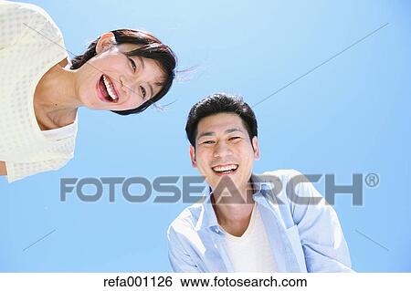 Happy Japanese couple smiling View Large Photo Image Stock Photograph - Happy Japanese couple smiling. Fotosearch
