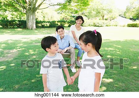 Happy Japanese family in a city park View Large Photo Image Picture - Happy Japanese family in a city park. Fotosearch