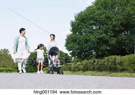 Happy Japanese family in a city park View Large Photo Image Picture - Happy Japanese family in a city park. Fotosearch